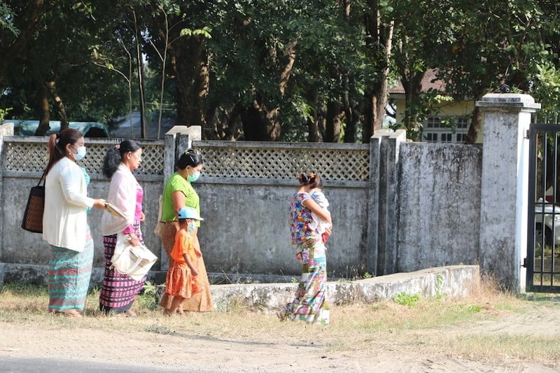 Supporters of a woman raped by three government soldiers enter a military compound in Sittwe, Rakhine state, Myanmar for a tribunal, Dec. 11, 2020. RFA Photo