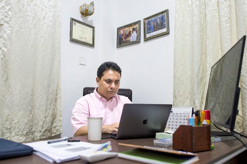 Aung Kyaw Moe, a Rohingya humanitarian worker, in his office in Yangon, Aug. 15, 2018. (Ye Aung Thu/AFP)