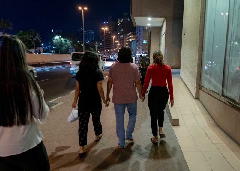 From left, Nwe Ni, Htay Htay Myint, Moe Moe Aye and Ei Nge walk in Deira. Nwe Ni tries to help migrants from Myanmar find safe environments in which to work and live. Photo by Gemunu Amarasinghe