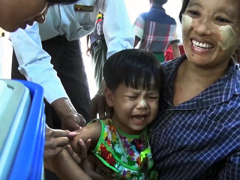 A child receives a vaccination in Yangon, Myanmar, June 25, 2021.