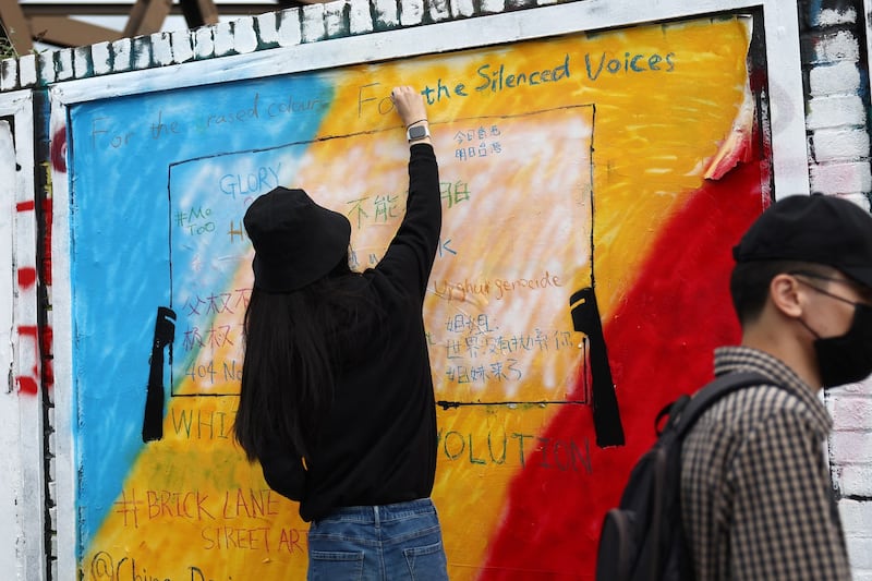 Political graffiti is written on a wall in Brick Lane, London, England, Aug. 7, 2023. Credit: Henry Nicholls/AFP