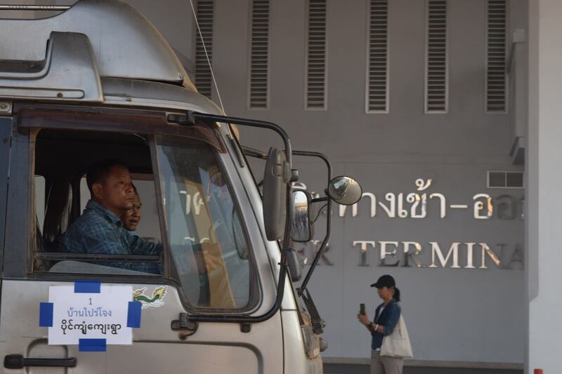 Drivers in a truck marked for Paingkyon village begin their journey outside Thailand's Customs House on March 25, 2024..JPG