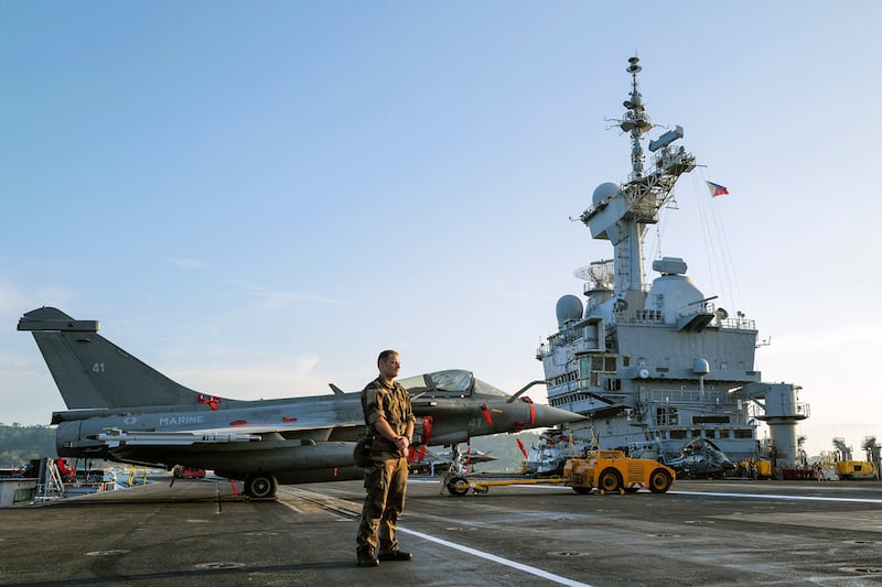 A French sailor is seen aboard the nuclear-powered aircraft carrier Charles de Gaulle in the port of Subic, Zambales province, Philippines, Feb. 23, 2025.