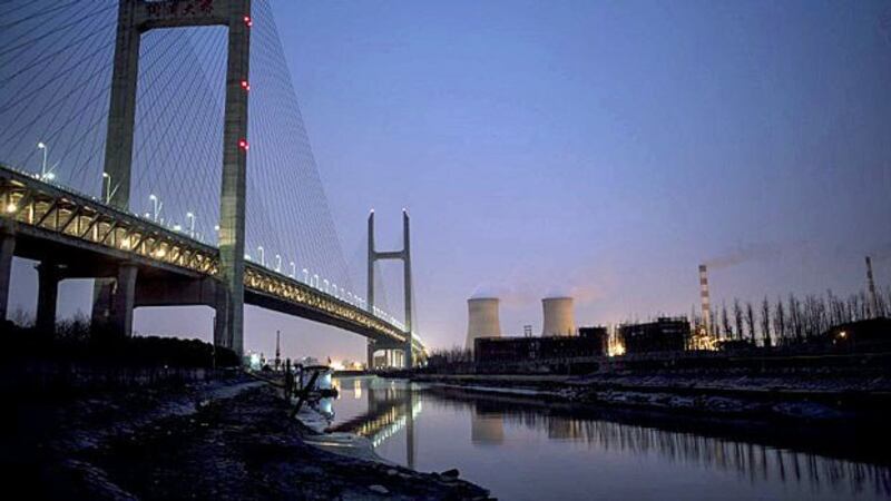 A view of the Wujing Coal-Electricity Power Station from below the Minpu Bridge that spans the Huangpu River in Shanghai, Feb. 21, 2017. 