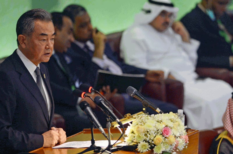 Chinese Foreign Minister Wang Yi (L) speaks during the 48th session of the Organization of Islamic Cooperation's Council of Foreign Ministers in Islamabad, Pakistan, March 22, 2022. Credit: AFP