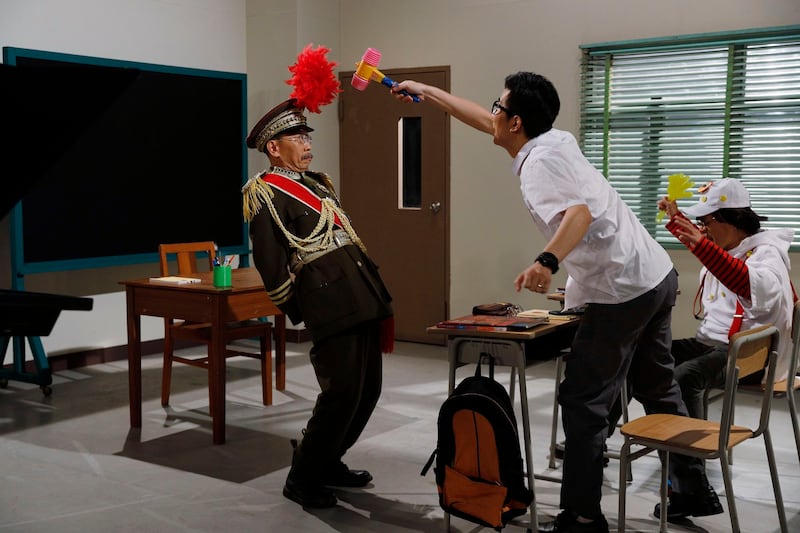 Actors perform in the television show "Headliner" at a studio in Hong Kong, June 17, 2020. Radio Television Hong Kong's Podcast One has removed 30 years of episodes of the show, which was axed in 2020. Credit: Kin Cheung/Associated Press