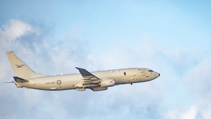 A file photo showing a Royal Australian Air Force P-8A Poseidon surveillance plane flying over the Indian Ocean during an exercise with the aircraft carrier USS Carl Vinson, Dec. 14, 2021. Credit: U.S. Navy