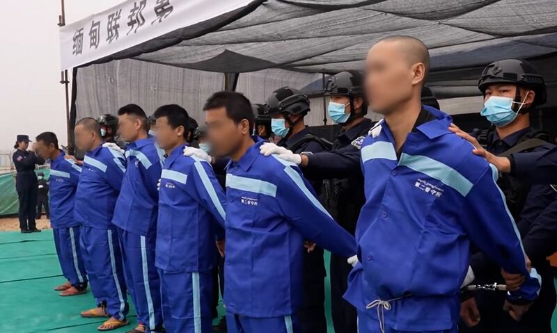 People sentenced by the Myanmar National Democratic Alliance Army are put on stage in front of a crowd in Laukkai town, northern Shan State, Dec. 5, 2024.