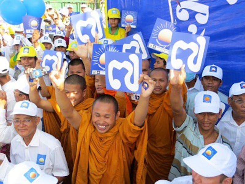 Monks join the Cambodia National Rescue Party rally in Kompong Cham, July 26, 2013. Photo credit: RFA.