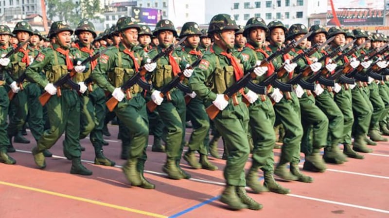 United Wa State Army soldiers march during a military parade commemorating 30 years of a bilateral cease-fire signed with the Myanmar military, in the town of Pangsang in Myanmar's Wa self-administered region, April 17, 2019.