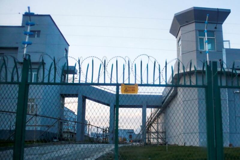 A perimeter fence surrounds what is officially known as a vocational skills education center in Dabancheng in northwestern China's Xinjiang region. Speaking about the centers, a Chinese official told the CESCR committee, 'They have the security measures that are necessary for a school, but they are completely different from those found in prisons and detention centers.' Credit: Reuters file photo