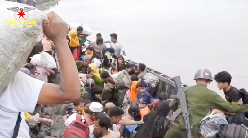 A screenshot from a video documents the Arakan Army rescuing Muslim elders, women, men and children from the Bo Hsu Village of Maungdaw Township, Aug. 8, 2024. (AA Info Desk via Telegram)