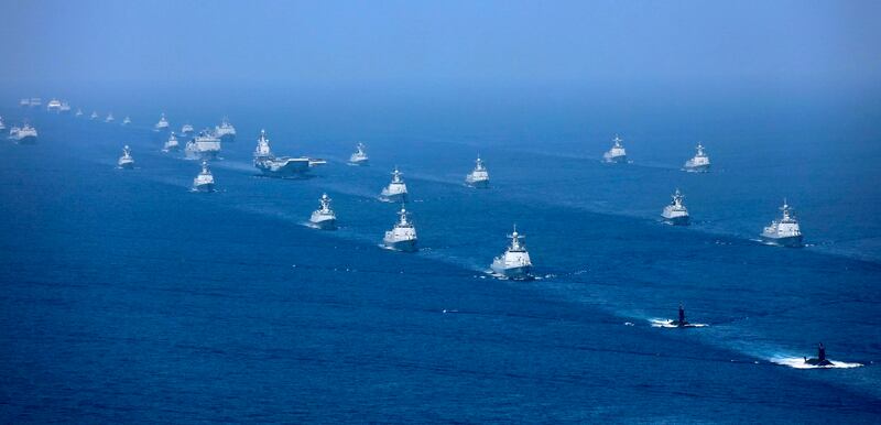 The Liaoning aircraft carrier is accompanied by navy frigates and submarines conducting an exercise in the South China Sea in 2018. Credit: Li Gang/Xinhua via AP