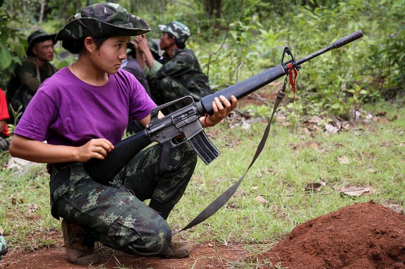 A member of the Karenni Nationalities Defence Force takes part in a training session for female special forces members and women's battalions at a camp in the forest near Demoso in Myanmar's eastern Kayah state, May 28, 2022. Credit: Karenni Nationalities Defence Force