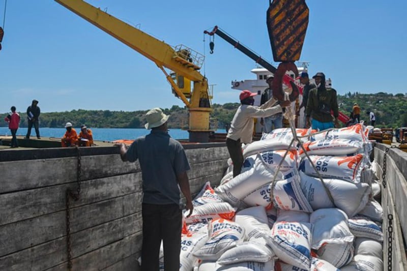 Workers unload sacks of rice imported from Thailand from a cargo ship at Malahayati Port in Krueng Raya, Aceh province, Indonesia, June 22, 2023. Credit: Chaideer Mahyuddin/AFP