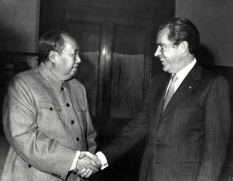 This file photo taken Feb. 22, 1972 shows China's Chairman Mao Zedong shaking hands with U.S. President Richard Nixon after their meeting in Beijing during the U.S. leader's official visit to China. Credit: AFP