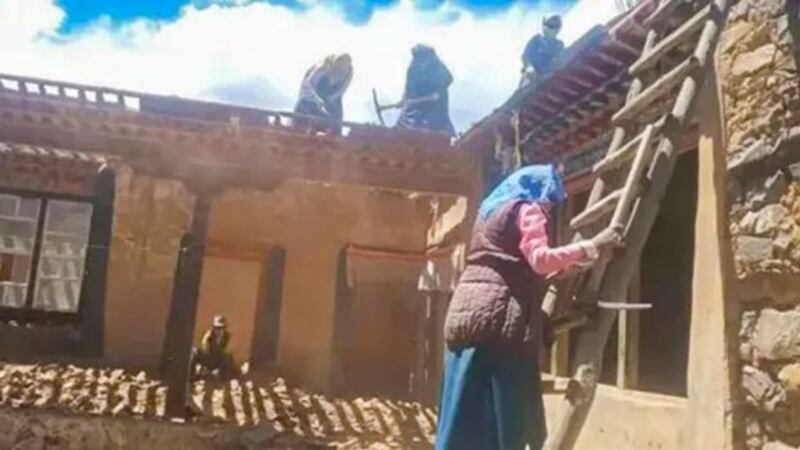 Tibetan villagers demolish their former houses in Tanggu Xiang, Lhundrup, in western China's Tibet Autonomous Region, June 2021. (Tanggu township government, Linzhou County, Lhasa TAR via HRW)