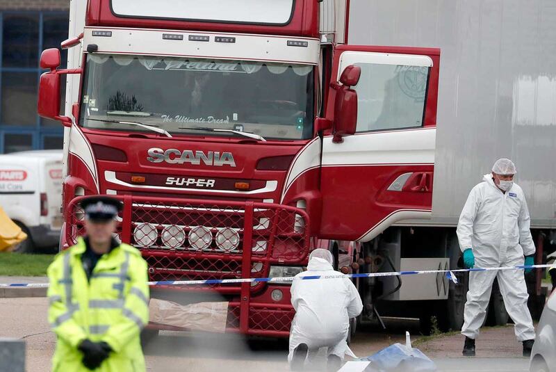 Police forensic officers attend the scene in Oct. 2019 after the truck containing the Vietnamese victims was found in Grays, South England. (Associated Press)