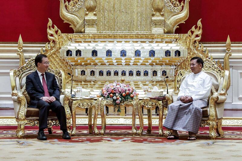 In this handout photo released by Myanmar Military, junta chief Min Aung Hlaing, right, receives Wang Ning, Secretary of CPC Yunnan Provincial Committee of China in Nay Pyi Taw, April 4, 2023. Credit: Myanmar Military handout photo via AFP