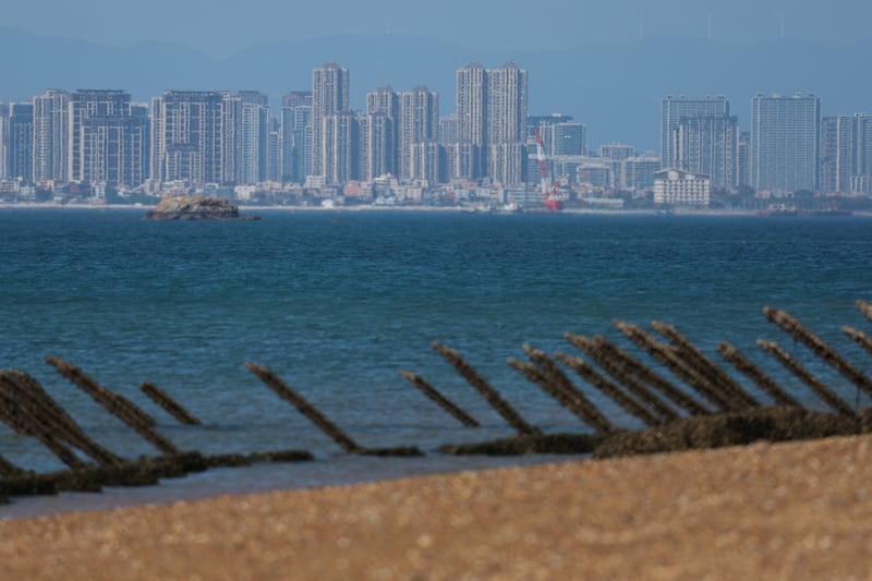 Anti-landing barricades are pictured on the beach, with China’s Xiamen city in the background, in Kinmen, Taiwan, Feb. 21, 2024.