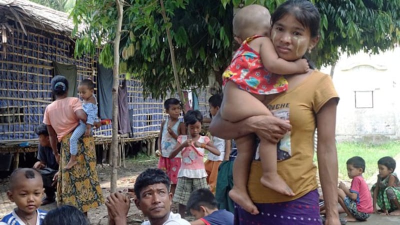 Ethnic Rakhine villagers, who fled from conflict between the Myanmar military and the Arakan Army, arrive at a temporary monastery camp in Sittwe, western Myanmar's Rakhine state, June 29, 2020.