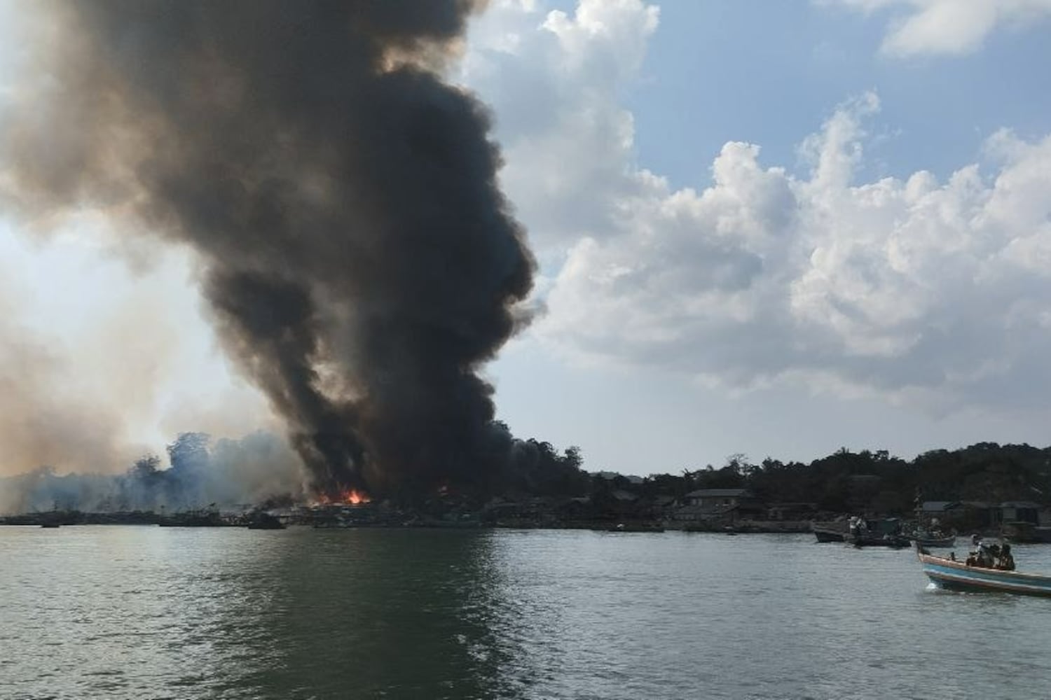 Smoke rises from fires in Kyauk Ni Maw village in Rakhine state after a Myanmar air force bombing raid on Jan. 8, 2025.