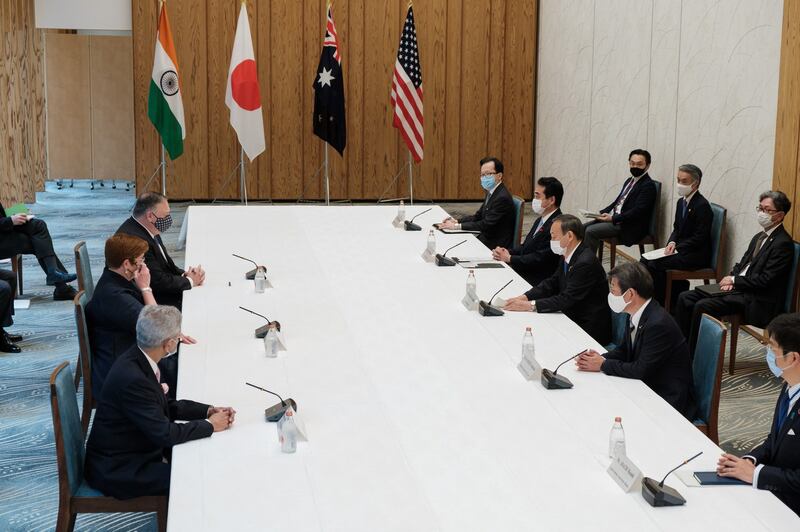 India's Foreign Minister Subrahmanyam Jaishankar (lower L), Japan's Foreign Minister Toshimitsu Motegi (2nd R), Japan's Prime Minister Yoshihide Suga (centre R), Australia's Foreign Minister Marise Payne (centre L) and US Secretary of State Mike Pompeo (top L) attend a Quad Indo-Pacific meeting at the prime minister's office in Tokyo, Oct. 6, 2020.