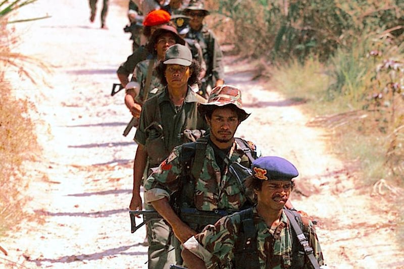 East Timorese pro-independence FALINTIL rebels set off on patrol Oct. 3, 1999.