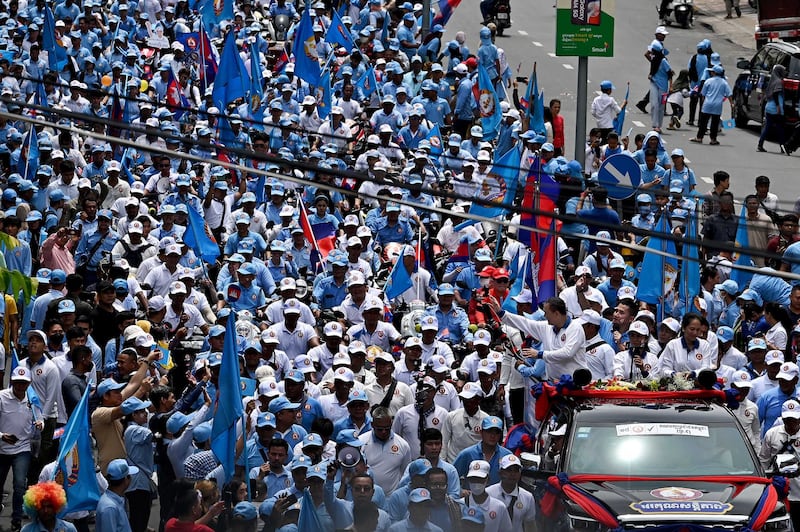 Hun Manet greets supporters during a campaign rally in Phnom Penh in July 2023. Prime Minister, Hun Manet, will meet with Cambodia's aggravated private sector for his administration's first Government-Private Sector Forum in November which his nascent government has been preparing for months. Credit: Tang Chhin Sothy/AFP