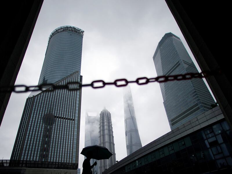 A man walks in Lujiazui financial district in Pudong in Shanghai,  China Sept. 17, 2020.