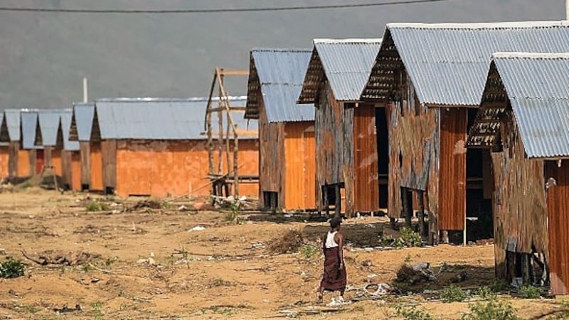 A man passes through the construction site of the Hla Pho Khaung processing camp for returning Rohingya refugees near the Bangladesh border in Maungdaw district, western Myanmar's Rakhine state, April 24, 2018.