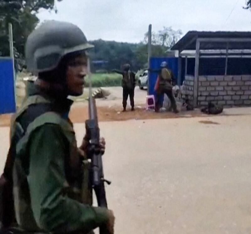 Myanmar National Democratic Alliance Army soldiers seize Myanmar military security gate near Laukkai city in Northern Shan state, Friday, Oct. 27, 2023. Credit: Screenshot from AFP video