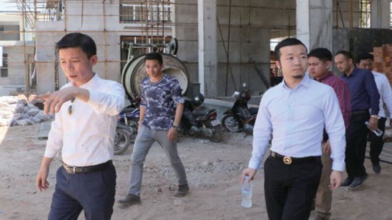 Chen Zhi pictured (right), visiting a Prince Group construction site in Sihanoukville, accompanied by company vice president Qiu Guo Xing (left), in an advertorial in the Phnom Penh Post April 27, 2017