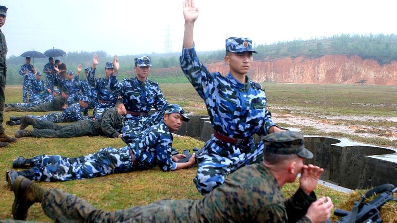 Troops from People's Liberation Army Marine Corps at a “Marine Day” get-together with visiting U.S. Marines in Zhanjiang, China on Nov. 16, 2006. 