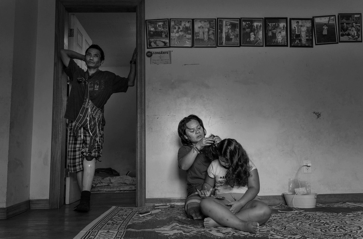 Nyah Mway's mother Chee War, father Ka Lee Wan, and little sister Paw War at their home in Utica, New York, Aug. 18, 2024.