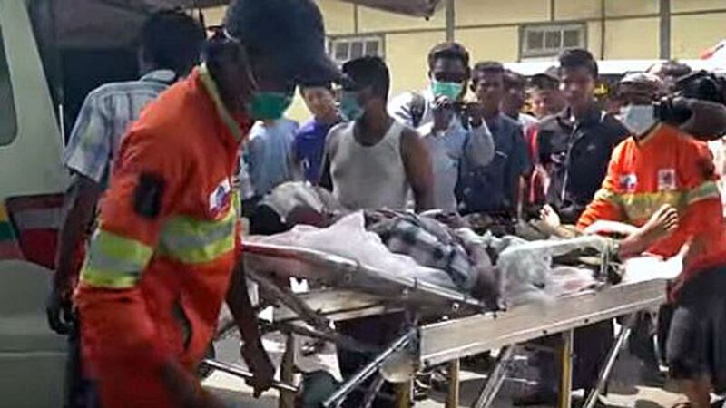 Medics transfer a civilian injured by heavy shelling in Kyauk Seik village to a hospital in Ponnagyun township, western Myanmar's Rakhine state, April 13, 2020.