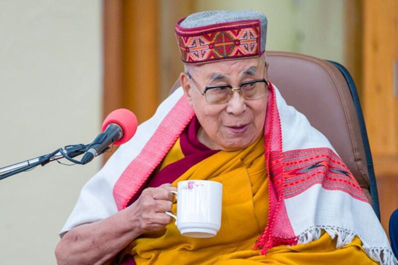 The Tibetan Buddhist spiritual leader, the Dalai Lama, sips tea at the Tsuglakhang temple in Dharamsala, India, Feb. 28, 2023. (Ashwini Bhatia/AP)