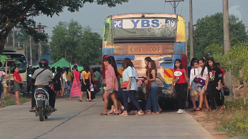 Workers arrive at a factory in Yangon, in an undated photo. Credit: RFA