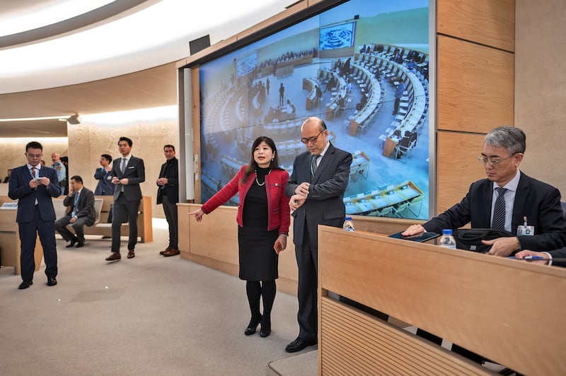 Head of the Chinese Mission to the UN in Geneva Chen Xu looks at his watch prior to the review of China's rights record by the United Nations Human Rights Council in Geneva, Jan. 23, 2024. (Fabrice Coffrini/AFP)