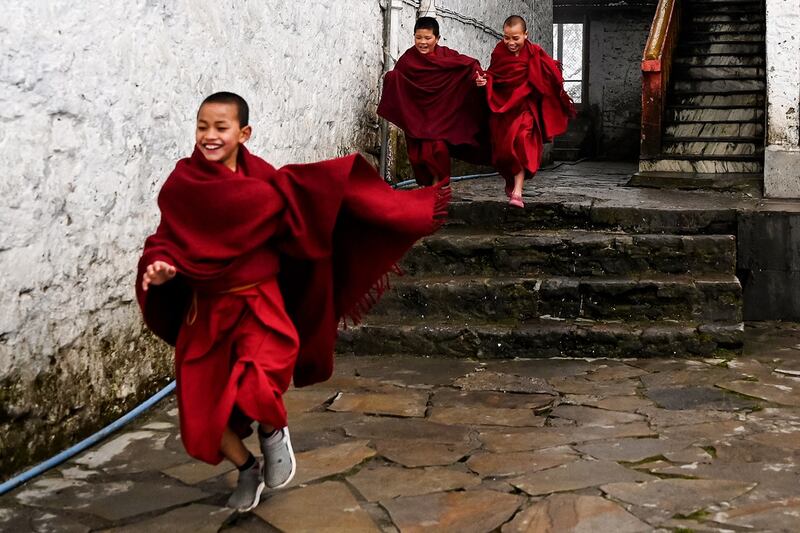 Young Buddhist monks play between prayers at the Tawang monastery in Tawang town in Arunachal Pradesh on April 5, 2023. (Arun Sankar/AFP)