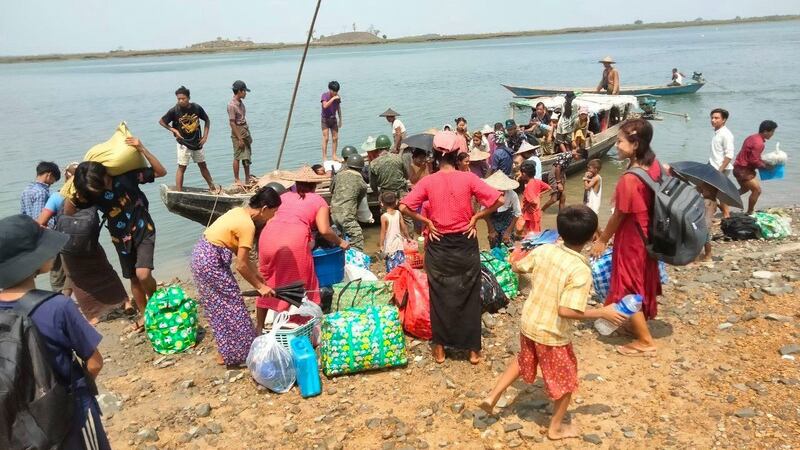 Members of the Arakan Army, an ethnic Rakhine rebel group, evacuates residents from the coast and low-altitude areas in Rakhine state, Myanmar. Credit: Arakan Army