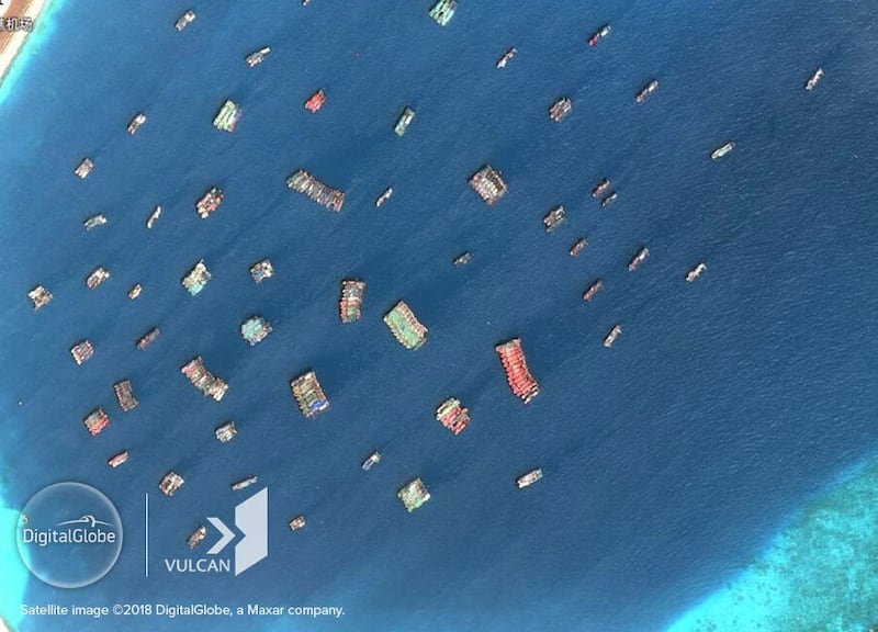 Chinese fishing vessels massed at Subi Reef in the Spratly Islands, Aug. 12, 2018. Credit: DigitalGlobe, Inc. and Vulcan Technologies LLC