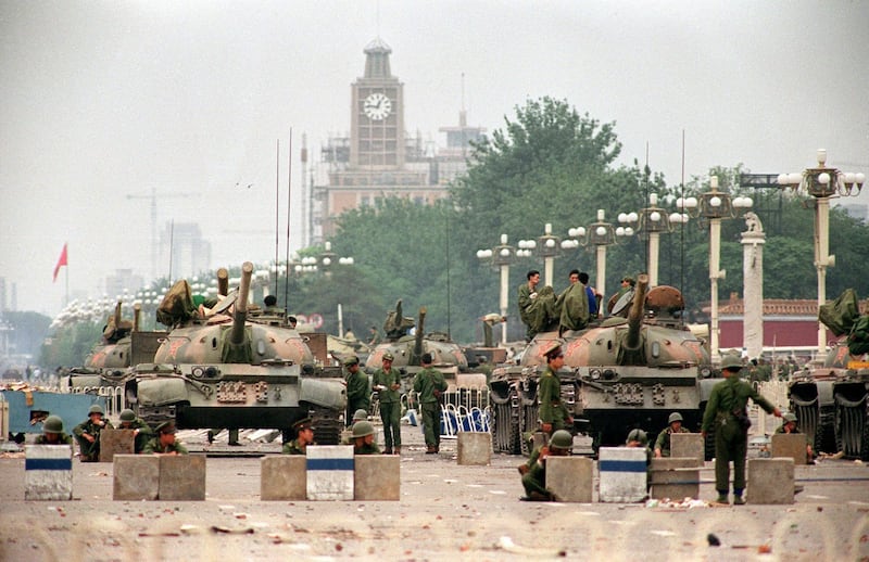 People's Liberation Army (PLA) tanks guard a strategic Chang'an Avenue leading to Tiananmen Square on June 6, 1989. Credit: AFP