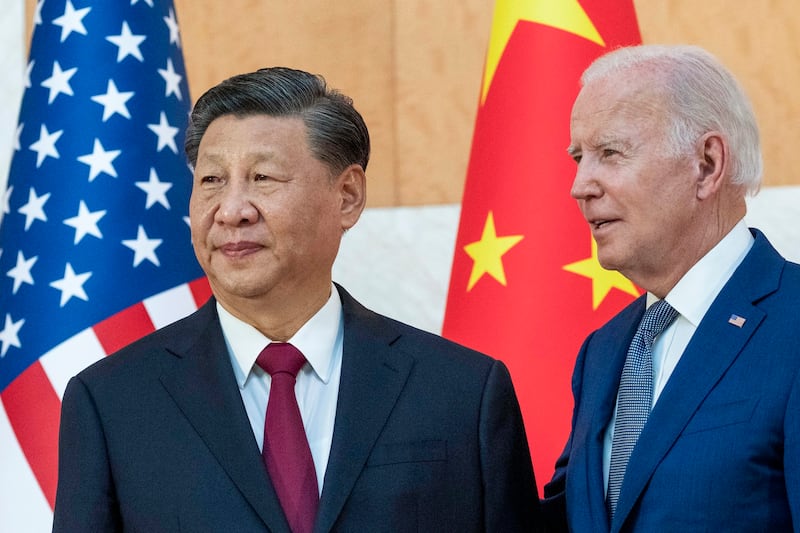 U.S. President Joe Biden [right] stands with Chinese President Xi Jinping before a meeting on the sidelines of the G20 summit meeting, Nov. 14, 2022, in Bali, Indonesia. Credit: Associated Press