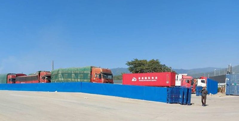 Cargo vehicles arrive at the Kyinsankyawt border gate in Myanmar’s Muse township in Dec. 2021.