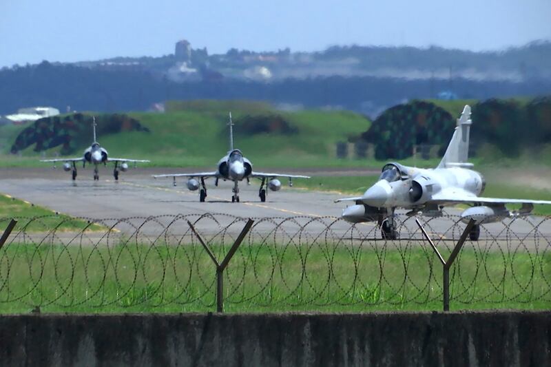 Taiwan Air Force Mirage fighter jets taxi on a runway at an airbase in Hsinchu, Taiwan, Friday, Aug. 5, 2022. China says it summoned European diplomats in the country to protest statements issued by the Group of Seven nations and the European Union criticizing threatening Chinese military exercises surrounding Taiwan. Credit: AP