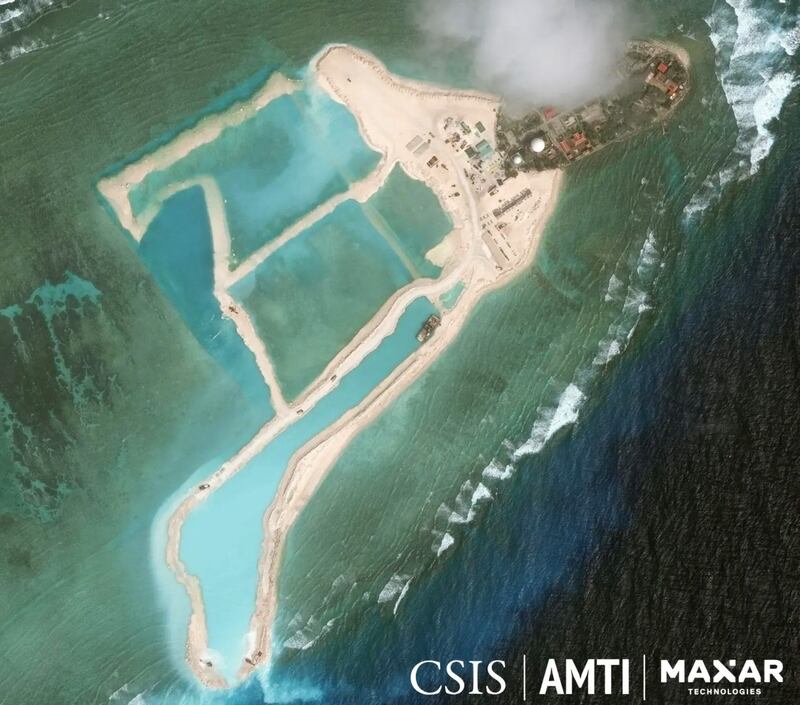 Clear evidence of dredging and landfill work is seen to the left of Vietnam's outpost on Pearson Reef in this image taken Feb. 11, 2022. Credit: “CSIS Asia Maritime Transparency Initiative / Maxar Technologies