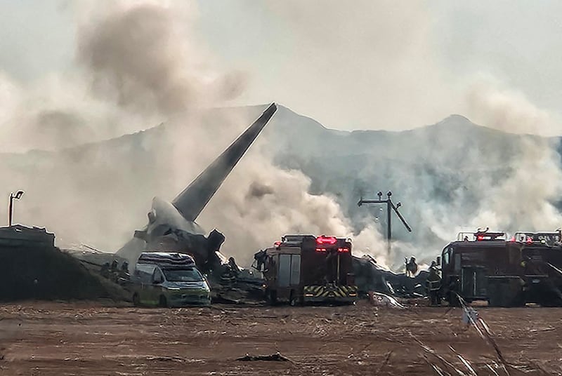 Firefighters try to put out a fire on an aircraft which skidded off the runway at Muan International Airport in Muan, South Jeolla Province, South Korea, Dec. 29, 2024.