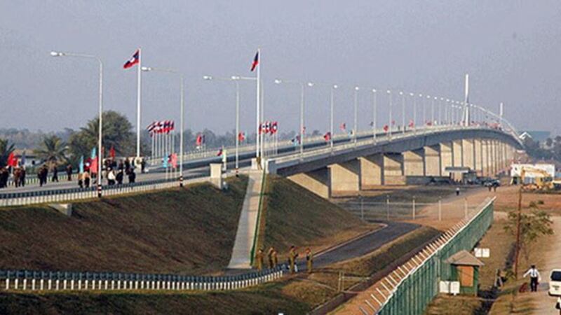 Lao citizens prepare to cross the Second Thai–Lao Friendship Bridge over the Mekong River, connecting Thailand's Mukdahan province with Laos' Savannakhet province, April 2019.