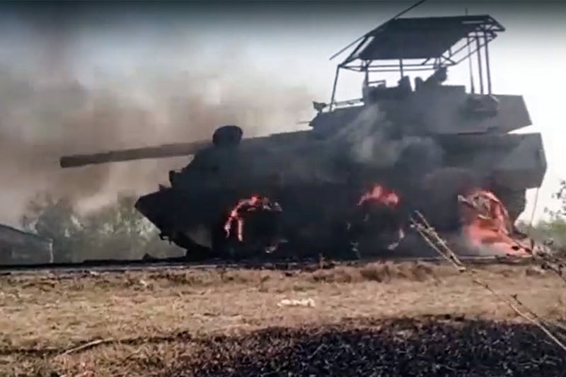 A Myanmar junta armored vehicle burns after Arakan Army forces attacked a column that left Sittwe in Rakhine state on Feb. 28, 2024.